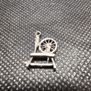 Small silver Charm of a Spinning Wheel