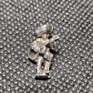 Silver Mexican playing Guitar